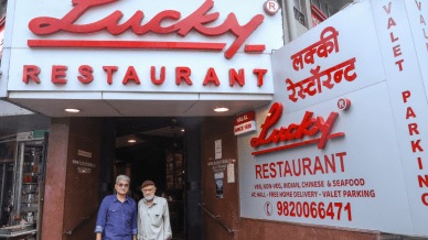 Syed Safar Ali Husaini with his son S. Mohsen outside Lucky Restaurant. Express photos by Akash Patil