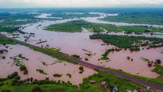 Solapur: Floodwaters from the overflowing Sina River spread across the Solapur-Pune railway line area in Mohol taluka, inundating villages and agricultural lands, disrupting railway connectivity, and forcing evacuations, in Solapur, Maharashtra, Tuesday, Sept. 23, 2025. (PTI09_23_2025_000290A)