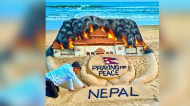 Puri, Sep 11 (ANI): Sand artist Sudharshan Pattnaik creates a sand sculpture of praying for peace in Nepal, in Puri beach on Thursday. (@sudarsansand X/ANI Photo)
