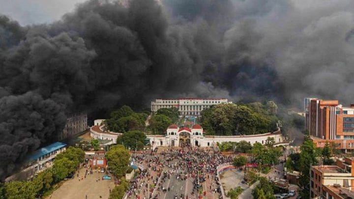 Protesters celebrate at the parliament building after it was set on fire during a protest against social media ban and corruption in Kathmandu, Nepal, Tuesday, Sept. 9, 2025. (AP Photo)