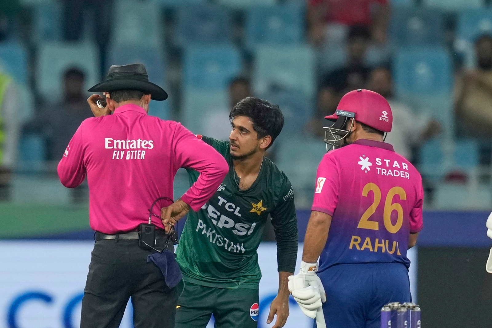 Pakistan's Saim Ayub removed Palliyaguruge's hat and the 57-year-old could be seen holding the area around his left ear. (AP Photo)