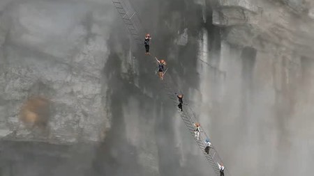 Explore China’s thrilling Sky Ladder—a hanging ladder spanning 551 feet, 5,000 feet above ground in Zhangjiajie Nature Park