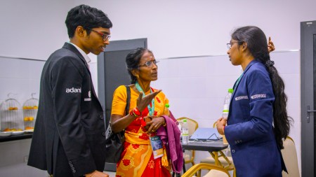 Vaishali Rameshbabu with Praggnanandhaa and their mother Nagalakshmi after Vaishali's win in round 6 of the FIDE Women's Grand Swiss in Samarkand. (PHOTO: Michal Walusza / FIDE)
