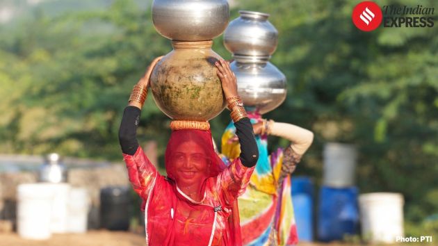 women fetch water from wells