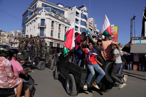 Troops loyal to CAPSAT military unit commander Col. Michael Randrianirina make their way to the Presidency to announce that the armed forces are taking control of the country in Antananarivo, Madagascar, Tuesday, Oct. 14, 2025. (AP Photo/ Brian Inganga)