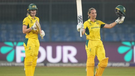 Australia's Ashleigh Gardner (R) celebrates her century with teammate Annabel Sutherland during the ICC Women's World Cup match against England. (PHOTO: AP)