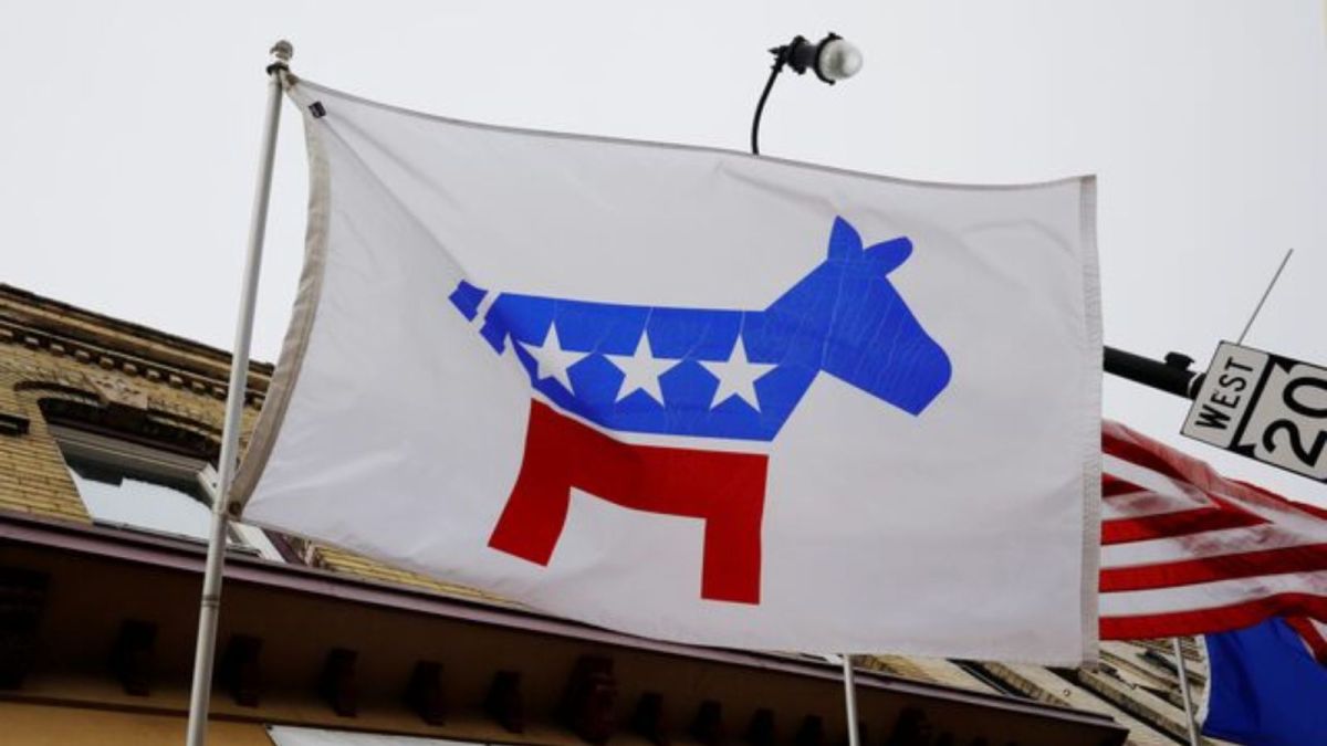 A flag with a logo of the Democratic Party flies over the office of the Racine County Democratic Party in Racine, Wisconsin, U.S., April 27, 2019. REUTERS/Brian Snyder/File Photo