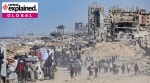 Palestinians return to inspect their destroyed homes in the Tal al-Hawa area, southwest of Gaza City, Oct. 11, 2025.