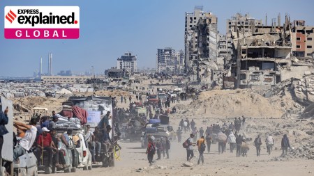Palestinians return to inspect their destroyed homes in the Tal al-Hawa area, southwest of Gaza City, Oct. 11, 2025.