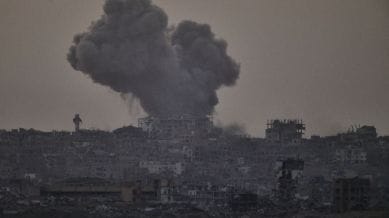 Smoke rises amid buildings, that were destroyed during the Israeli ground and air operations, following an Israeli military strike in the northern Gaza Strip, as seen from southern Israel, Friday, Oct. 3, 2025. (AP Photo/Leo Correa)