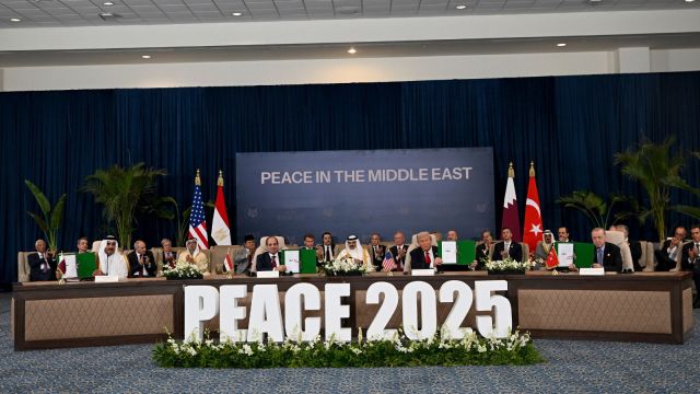 In front, from left: Egypt’s President Abdel Fattah el-Sissi and President Donald Trump are joined by dozens of other leaders for a summit in hopes of turning the new Israel-Hamas cease-fire into more lasting peace, in Sharm El-Sheikh, Egypt, Oct. 13, 2025. Getting Hamas to lay down its arms, and demilitarizing the Gaza Strip — key preconditions to Israel to pulling out of Gaza fully, as reiterated by President Donald Trump and Prime Minister Benjamin Netanyahu on Monday, will likely prove to be far harder than the cease-fire and return of hostages. (Kenny Holston/The New York Times)