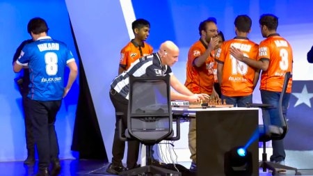 Gukesh's teammates like Arjun Erigaisi and Sagar Shah pat Gukesh on the back after his loss to Hikaru Nakamura at the Checkmate: USA vs India clash in Arlington, Texas. (Screengrab via ChessBase India YouTube)