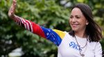 Maria Corina Machado waves from atop a truck during the closing election campaign rally for presidential candidate Edmundo Gonzalez in Caracas, Venezuela, Thursday, July 25, 2024. (AP Photo/Matias Delacroix, File)