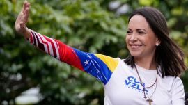 Maria Corina Machado waves from atop a truck during the closing election campaign rally for presidential candidate Edmundo Gonzalez in Caracas, Venezuela, Thursday, July 25, 2024. (AP Photo/Matias Delacroix, File)