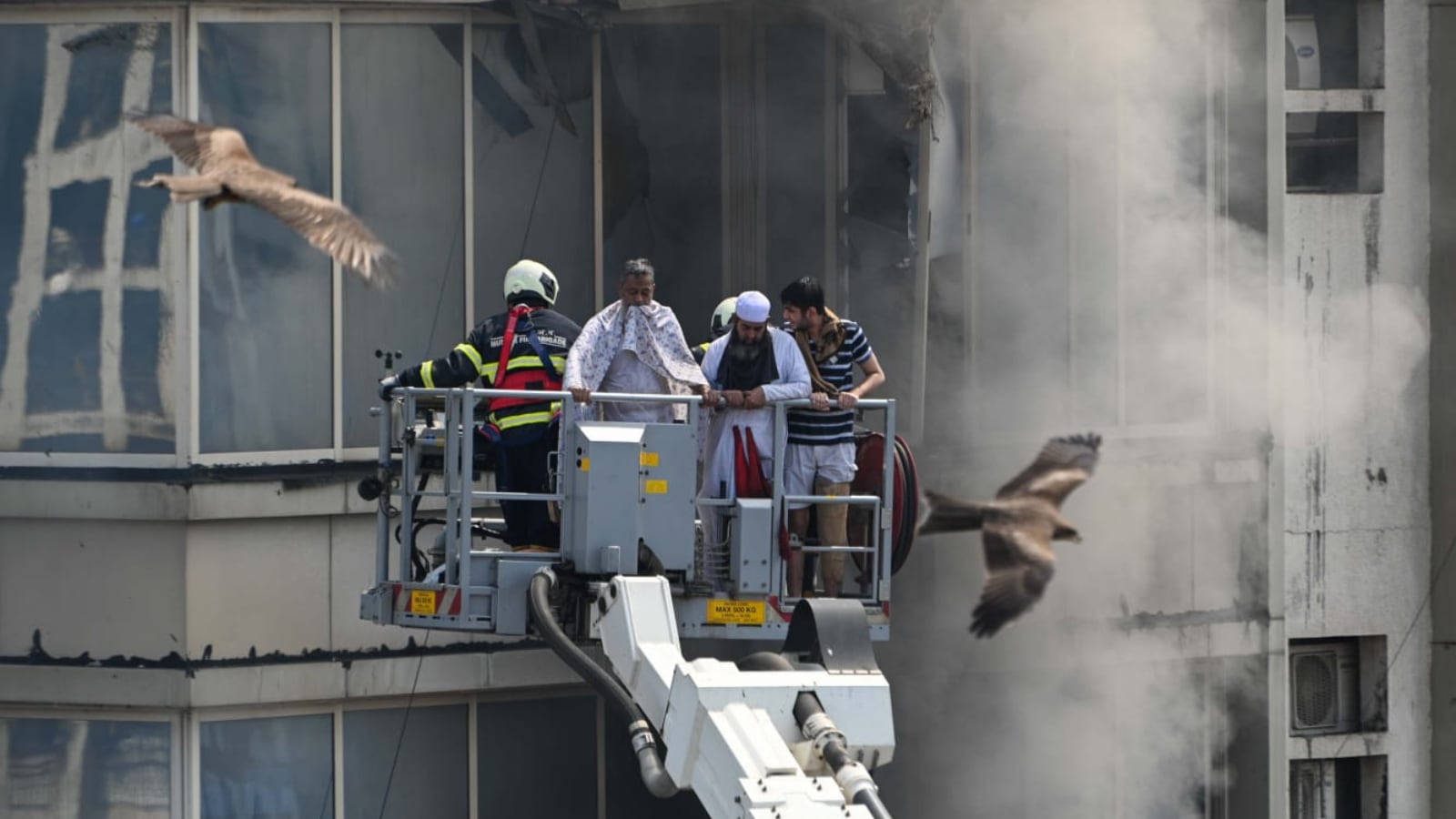 Mumbai building fire: Fire department personnel rescue people from the building in Jogeshwari (Express Photo: Sankhadeep Banerjee)