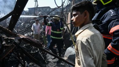 Firefighters extinguish a level 02 fire at Kapadia Nagar, Kurla west in Mumbai. (Express photo by Sankhadeep Banerjee.)
