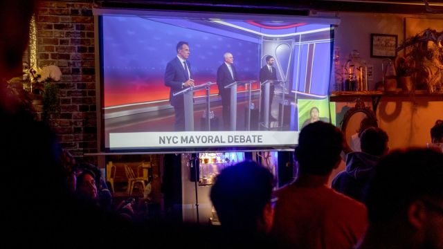 Supporters of Zohran Mamdani, the Democratic candidate for New York City mayor, watch the first New York City mayoral debate at an Iranians for Zohran watch party, at the bar Cocktail Bedstuy in Brooklyn, on Thursday, Oct. 16, 2025. (Anna Watts/The New York Times)