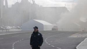 Video footage as reported by Reuters showed armed security officers rushing toward the burning tent outside the parliament complex.