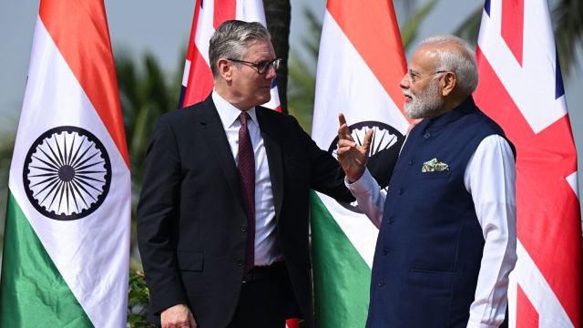British Prime Minister Keir Starmer, left is greeted by Indian Prime Minister Narendra Modi on his arrival at Raj Bhavan in Mumbai (AP)