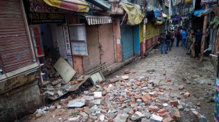 Varanasi Dalmandi demolition:Road widening work underway from Dalmandi Market to Shri Kashi Vishwanath Temple, in Varanasi, Wednesday. (PTI photo)