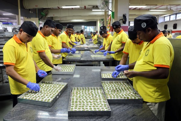 Worker giving final touches to a mithai inside Prashant Corner's 1,00,000 sq ft factory spreading across multiple floors in Wagle Estate