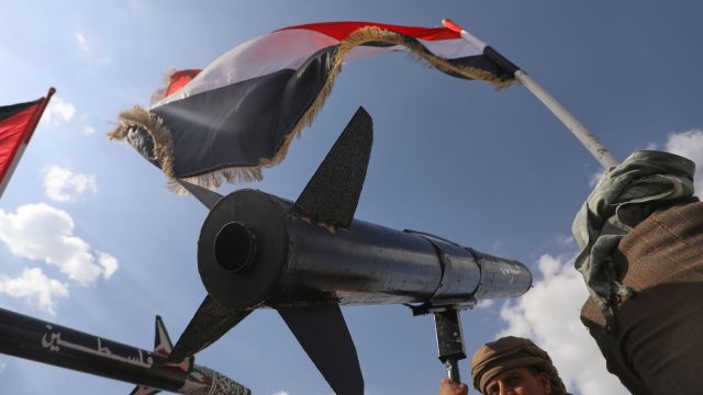 A Houthi supporter chants slogans as he carries a rocket replica during an anti-U.S. and anti-Israel rally in Sanaa, Yemen, following Israeli airstrikes in Sanaa, Yemen, Friday, Sept. 26, 2025. Arabic on the rocket reads, "Palestine". (AP Photo/Osamah Abdulrahman)