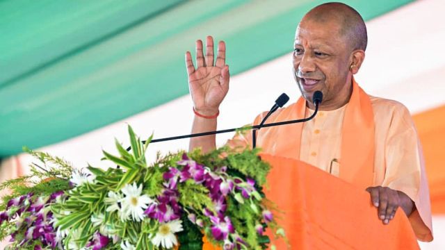 Uttar Pradesh Chief Minister Yogi Adityanath addresses public during the distribution of flat keys under a residential project, in Gorakhpur (ANI)