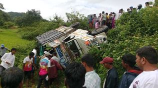 preliminary observations suggest that the driver lost control on a patch of wet grass where the vehicle skidded and landed in a roadside trench a few feet deep.