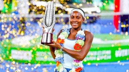 Coco Gauff of the United States celebrates with her trophy after defeating her compatriot Jessica Pegula in the women's singles final at the WTA Wuhan Open in Wuhan in central China's Hubei province Sunday, Oct. 12, 2025. (Chinatopix Via AP)