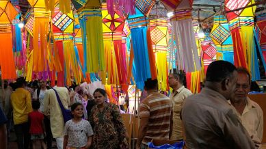 Lanterns are displayed for sale at roadside stalls as people shop ahead of Diwali festival in Mumbai, India, Thursday, Oct. 16, 2025. (AP Photo/Rajanish Kakade)