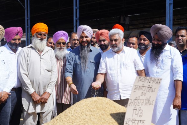 Punjab minister Lal Chand Kataruchak during a visit to a grain market in Hoshiarpur. 