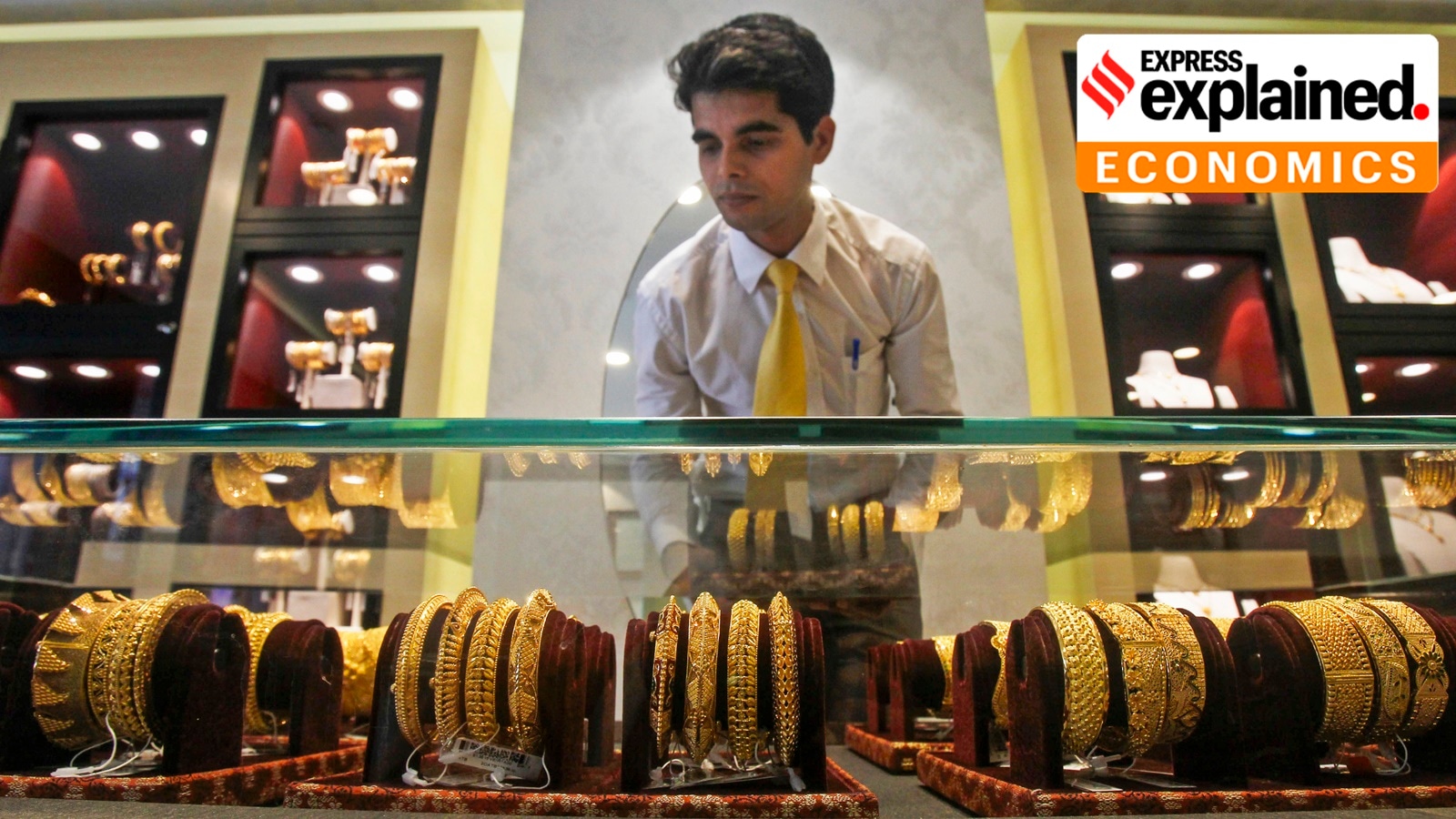 Gold Silver ETF India: An employee displays gold ornaments at a jewellery showroom ahead of 'Dhanteras' festival, in Agartala, Thursday, Oct. 9, 2025.