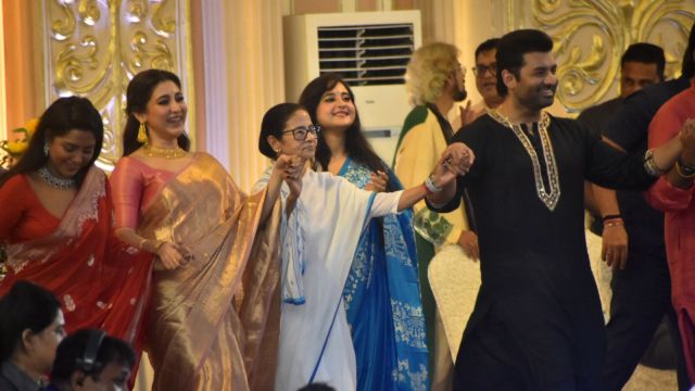 West Bengal Chief Minister Mamata Banerjee with actor Ankush Hazra during Durga Puja Carnival in Kolkata, Sunday evening. Express