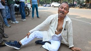 As far as protests by ticket seekers go, the image of Sah rolling on the ground with his clothes torn may linger longer. (Express Photo)