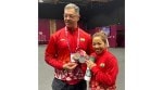 Mirabai Chanu and her coach Vijay Sharma with the World Championship medals. Mirabai won a bronze in snatch and silver overall. (Photo via Special Arrangement)