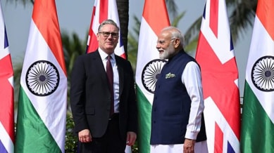 British Prime Minister Keir Starmer, left is greeted by Indian Prime Minister Narendra Modi on his arrival at Raj Bhavan in Mumbai