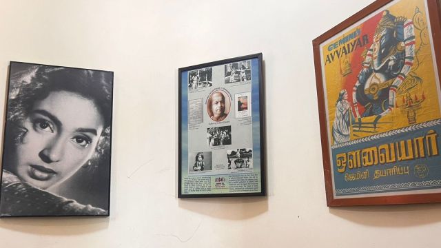 Along the stairway, more posters speak — Shammi mid-dance, Madhubala’s smile promising romance, Raj Kapoor in full Technicolor drama. Each brushstroke is a reminder that posters weren’t ads; they were invitations to fall in love with cinema.
