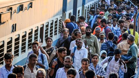Passengers rush to board a train as they leave for their native places ahead of the Diwali Festival at Patna Junction Railway Station on October 15 (ANI Photo)
