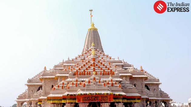 The 10-foot-by-20-foot saffron banner ascends to the summit of the temple