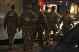 Nation Guard move through the area following the shooting of two National Guard soldiers near the White House Wednesday, Nov. 26, 2025, in Washington. (AP Photo/Mark Schiefelbein)