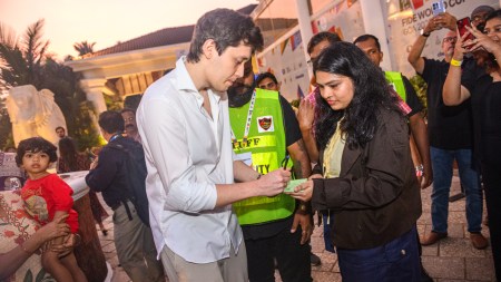 Russian Grandmaster Andrey Esipenko signing autographs after winning the last Candidates spot through FIDE World Cup. (PHOTO: Michal Walusza/FIDE)