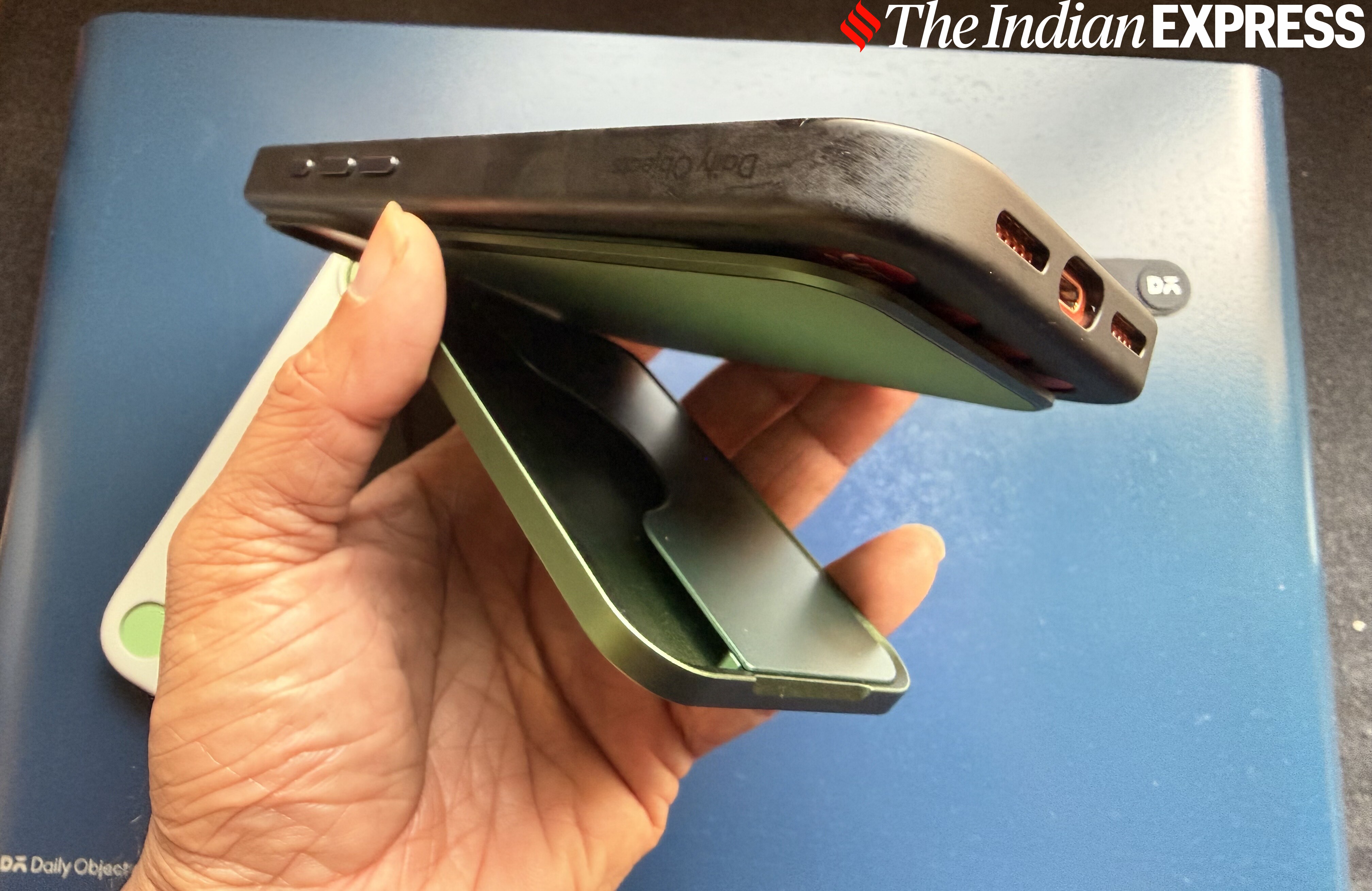 This reminds one of a stick-on battery pack, but it is a flip-out case that can hold credit cards or IDs