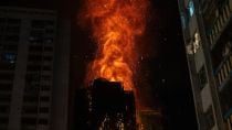 Flames engulf a building after a fire broke out at Wang Fuk Court, a residential estate in the Tai Po district of Hong Kong's New Territories, Wednesday, Nov. 26 2025. (AP Photo/Chan Long Hei)