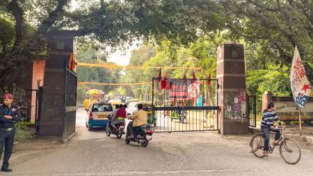 A security guard stands at the entrance to the Jawaharlal Nehru University (JNU) on the day of JNU Students' Union (JNUSU) elections. (PTI Photo)