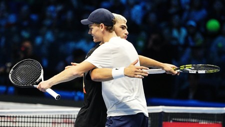 Jannik Sinner, right, and Carlos Alcaraz hug each other after practicing on the central court of the Inalpi Arena, where the ATP Finals will begin on Sunday, in Turin on Friday. (LaPresse via AP)