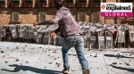 People throw rocks at police during clashes in Mexico City, Mexico, Nov. 15.