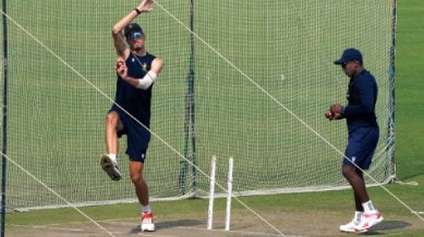 South Africa's Marco Jansen, left, bowls at net as Senuran Muthusamy, right, waits for his turn during the practice session ahead of the first test match between India and South Africa, in Kolkata, India, Wednesday, Nov. 12, 2025. (AP Photo)