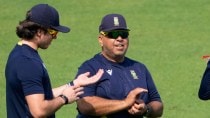 South Africa coach Chief coach Shukri Conrad, center, have discussions with Kesav Maharaj, right and another during the practice session ahead of the first test match between India and South Africa, in Kolkata, India, Wednesday, Nov. 12, 2025. (AP Photo)