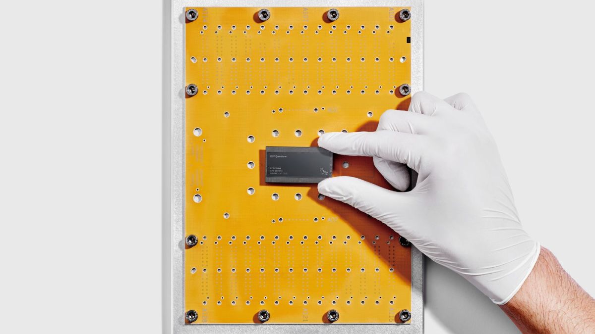 IBM researcher holds IBM Quantum Nighthawk chip