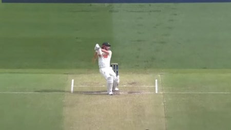 Travis Head hits a boundary through cover point against England's Brydon Carse in the 1st Ashes Test in Perth. (PHOTO: Screengrab via cricket.com.au YouTube)